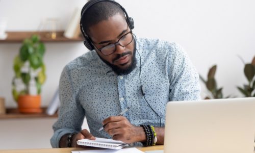 focus.african.headphones.write.notebook.webinar.watch.student.laptop.listen.learn