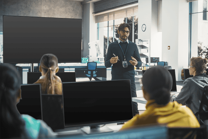 man teaching in front of class