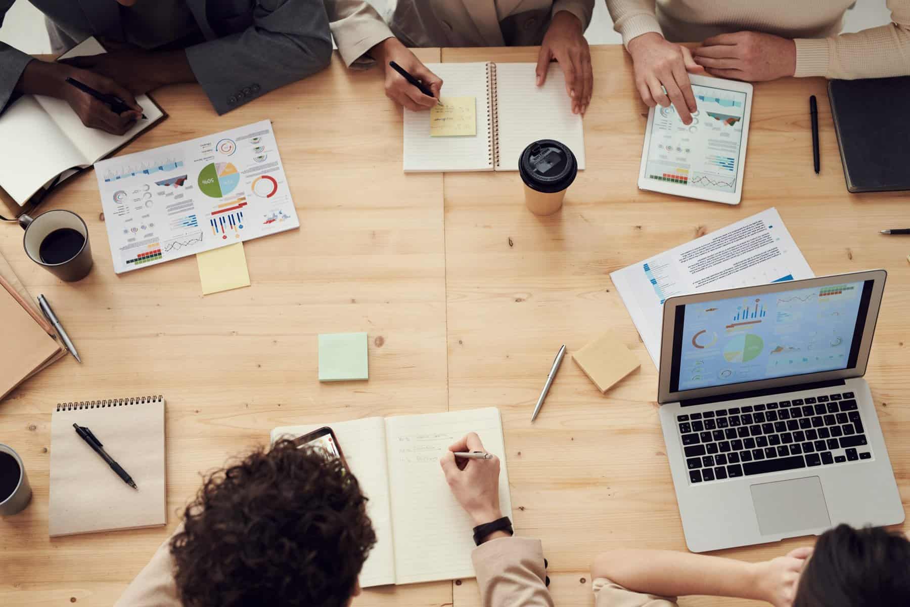 overhead view of people working at a table.