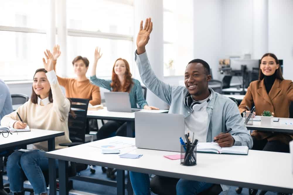 students raising hands in velociteach classroom